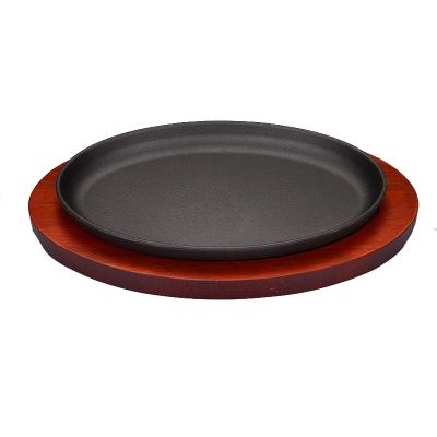 China Pre-Seasoned Cast Iron Oval Pre-Seasoned Oval Skillet Hot Fry Grill Grill Sizzling Steak Pan With Red Wood Base for sale