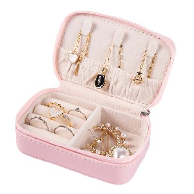 China Newest Wholesale Custom Logo PU Leather Small Travel White Pink Mini Jewelry Organizer Box Portable Slim Jewelry Storage Case for sale