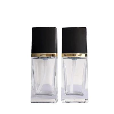 China Wholesale cosmetic packaging 30ml square essence lotion bottle foundation glass bottle with pump for sale