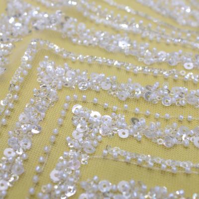 China Viable Wholesale High Quality Popular Design Bridal Dress Fabric Sequin White Lace Wedding for sale