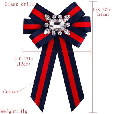 China Women Brooches New Crystal Stripe Ribbon Bow Tie Bow Tie Corsage Brooch For Women for sale