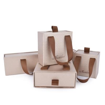 China Handmade elegant fancy paper with brown haddle ribbon square customized size printed logo paper box for sale