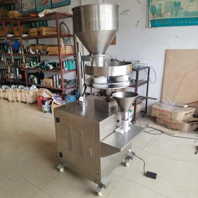 China Semi-automatic granule cup doser filling machine Small quantitative food pellet packaging machine Rice filling machine for sale