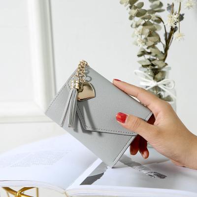 China Multifunctional Short Wallet Women's Fashion Tassel Student Change Clip Card Folding Bag for sale