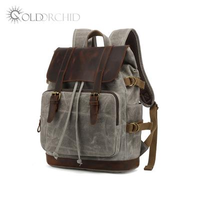 China Waterproof Vintage Canvas Leather Backpack For Hiking And Sports for sale