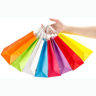 China Recycled Materials Wholesale Colorful White Kraft Paper Bag With Handle Wedding Party Favor Paper Gift Bags for sale