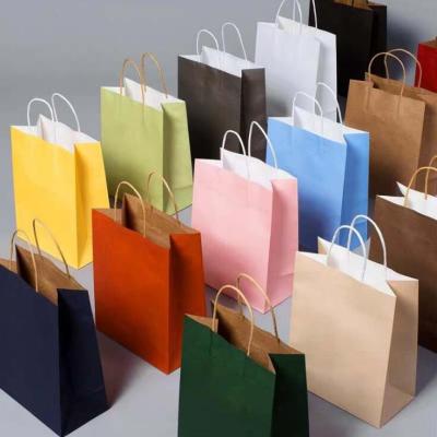 China Recycled Materials Wholesale Kraft Paper Gift Bag With Handles Wedding Party Favors Bags for sale