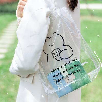 China 100% Transparent PVC Tote Bag With Logo Handles Wholesale Waterproof Clear Custom Fashion Shopping Eco-friendly Bag for sale