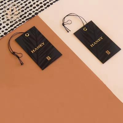 China Color Custom Kraft Print Clothing Tags Waterproof Custom Logo Tags For Clothing for sale