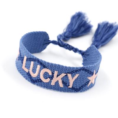 China Unisex Embroidery FASHIONABLE LOGO Webbing Wristbands Concert Jewelry by LUCKY Color Tassel Friendship Personality Bracelet for sale