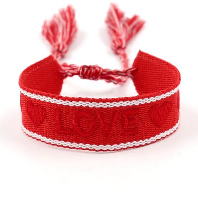 China Ethnic Style Personalized Red Strap Ethnic Wedding Jewelry Wrist Band Embroidered LOVE Tassel Heart Shaped Bracelet for sale