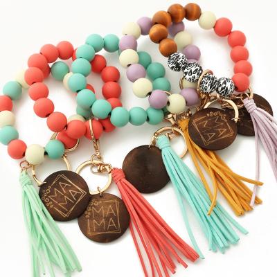 China MOM Keychains Silicon Wrist Wooden Engraved Keychains Bracelet Ring Monogram Leopard Wood Beaded Keychains Lilangda Promotion Gift New for sale