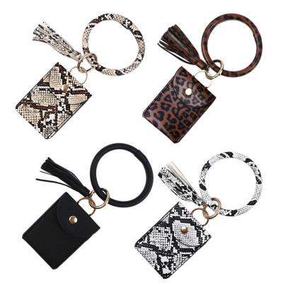 China Fashionable PU Leather Wallet Hot Selling Ring Key Charm Bracelet Tassel Chain Purse Credit Card Bag Chic Key Chain Wallet for sale