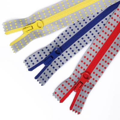 China Factory Wholesale Factory Wholesale Dot Hollow Reverse Nylon Zipper Fancy Polyester Waterproof Nylon Teeth Colorful Reflective Open End Zippers for sale