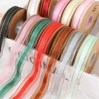 China Low Moq 25mm Sheer Moq 25mm Gift Christmas Floral Wrapping Snow Pull Hangs Sheer Metallia Edge Solid Color Organza Ribbon For Wrapping Decoration for sale