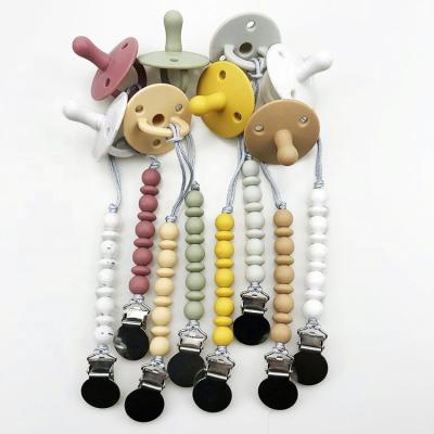 China Wholesale BPA Free 100% Natural Feel Nipple Full-Silicone Baby Pacifier With Pacifier Clip for sale