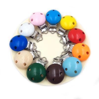 China 3 Holes Baby Accessories Non-Toxic Colorful Wooden Pacifier Clip for sale