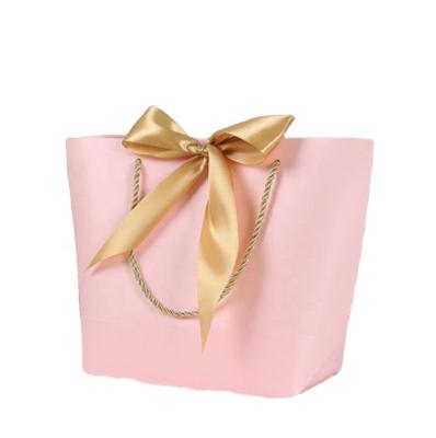 China Fashionable Customized Logo Color Bags Gift Decorative Handmade Paper Bags With BOW TIE for sale