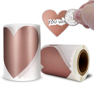 China 100PCS/ROLL Popular Custom Roll Self Adhesive Wrapping Heart Shaped Scratch Mark Logo Custom Rose Gold Sticker Labels Scraping Label Stickers for sale