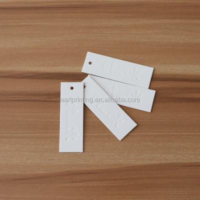 China Custom Made Debossed Viable Logo Paper Clothing Hang Tag for sale