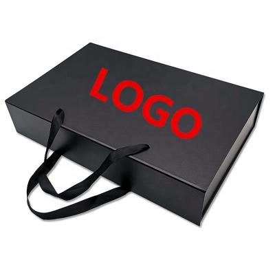 China Recycled Materials Wholesale Customized Black Printing Folding Cardboard Garment Clothes Packaging Magnetic Paper Boxes With Ribbon Handle for sale