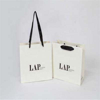 China Recyclable Eco Friendly Customized Logo Printed Shopping Bag White Paper With Handles for sale