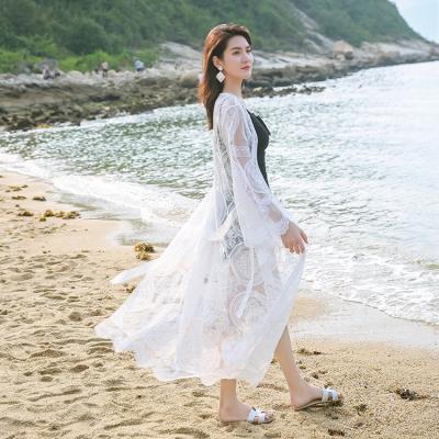 China 2022 sexy new arrival lace shawl beach blouse breathable white embroidery beach cardigan sunscreen holiday vacation for sale