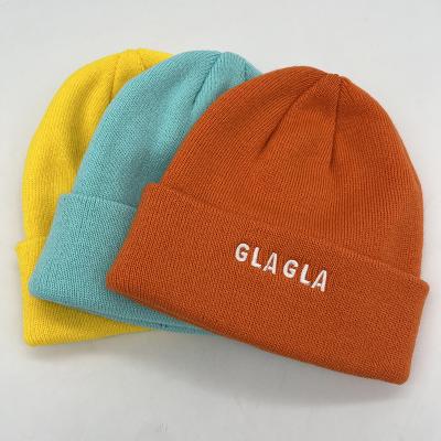 China Custom Wholesale COMMON Logo Unisex High Quality Plain White Dyed Solid Color Winter Hat Acrylic Hat Knitted Cuffed Beanie for sale