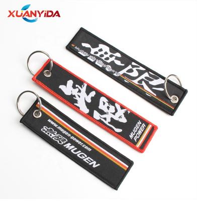 China High Quality Fabric Race Logo Metal Sublimation Key Chains for sale