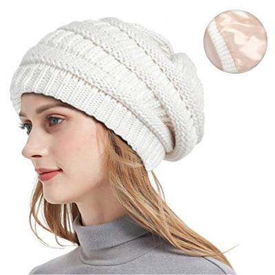 China Custom Winter COMMON COMMON Beanie Hat Soft Knitted Beanies with Satin Lining for Women for sale