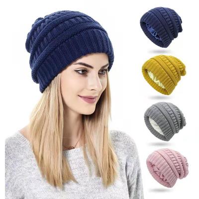 China Custom Soft Thick Knitted Striped Warm Winter Satin Beanie Hats COMMON COMMON Beanie Hats For Women for sale