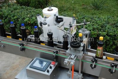 China TBK-630 Automatic Beverage Round Bottle Self Adhesive Labeling Machine / Hot Tour Bottle Sticker for sale