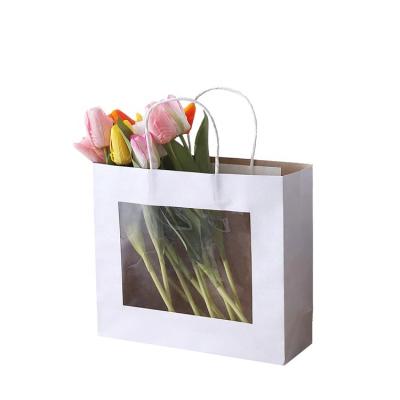 China Recyclable Customized White Kraft Paper Gift Packaging Flower Bouquet Bag With Handle for sale