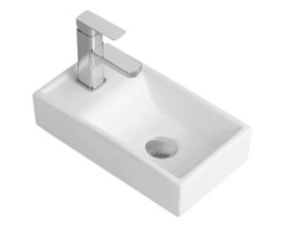 China Hot Selling Small Mini Art Hand Modern Ceramic Wash Basin Bathroom Rectangular Ceramic Sink Table Top for sale