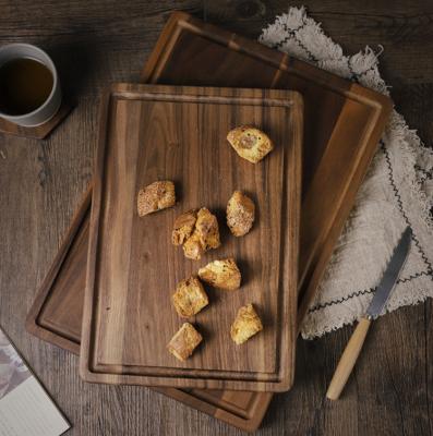 China Wholesale Customized Eco-friendly Walnut Wooden Food Safe Cutting Board Dark Wood Chopper With Groove for sale