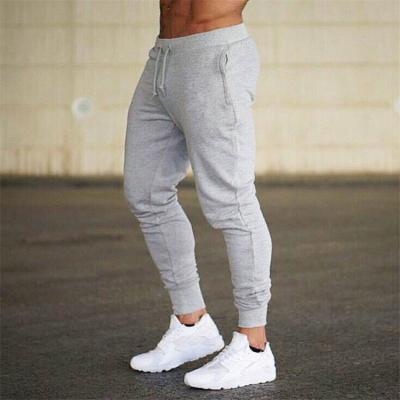 China Anti-wrinkle Mens Running Sports Pants Fitness Shaping Small Feet Men's Pants for sale