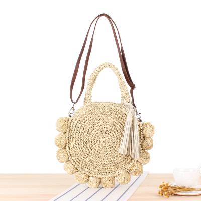 China Handmade Woven Handbag Angedanlia Summer Straw Bag PU Tassel Strap With Straw Pom Pom Ball for sale