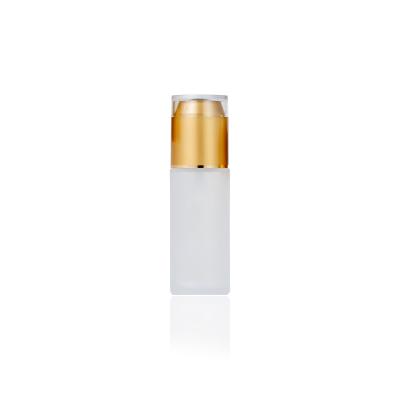 China Eco-friendly Recyclable Wholesale Luxury Skincare Packaging Cylinder Frosted Face Serum Glass Lotion Bottles With Gold Pump Cap for sale