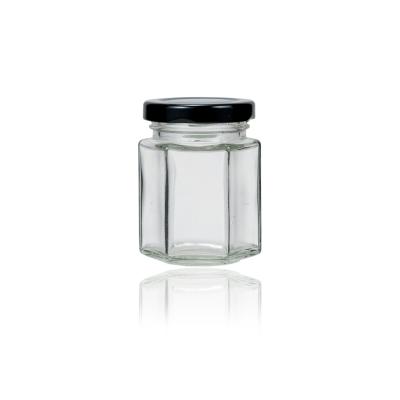 China Mini Hexagon 80ml Food Storage Container Glass Honey Jam Pickle Nut Jar Cheap Price Recyclable Factory Eco-Friendly With Metal Lid for sale