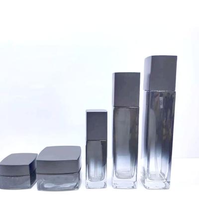 China Wholesale 50g Cosmetic Jar 100ml Black Square Empty Glass Cosmetic Pump Bottles Set For Tonner Cream And Skin Care Packaging for sale