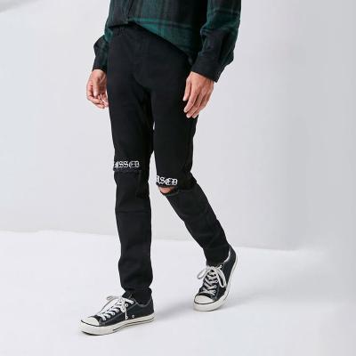 China OEM QUICK DRY Custom Mens Skinny Jeans in Embroidered Ripped Black Distressed Jeans Skinny Jeans for sale