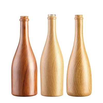 Chine Taille personnalisée Acceptée 750 ml / 350 ml Bouteille en verre à motifs en bois pour la bière, l' eau et le champagne à vendre