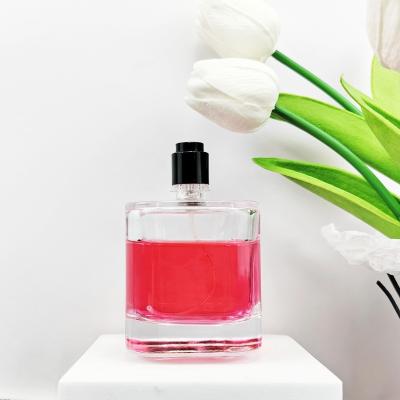 China Glass Body Material 100ml Unique Empty Perfume Bottle with Sprayer and Cork Cap for sale