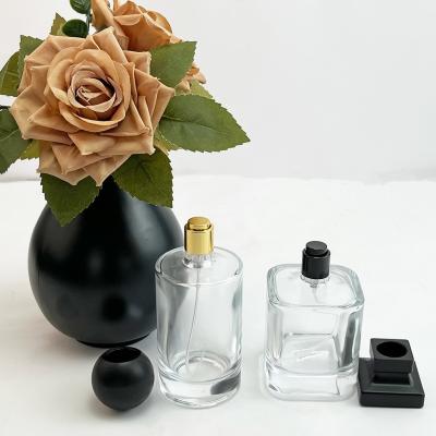 China Collar Material Glass Products Empty Perfume Cylinder Glass Bottles 30ml 50ml 100ml for sale