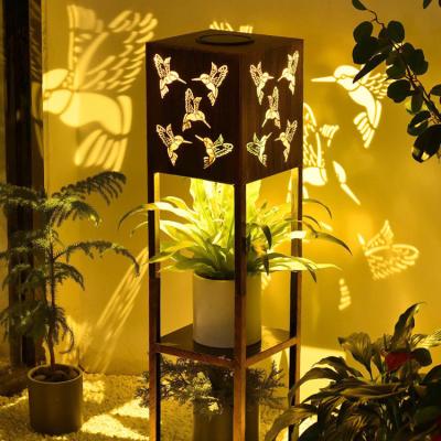 China Eco-friendly Modern Garden Landscape Lawn Light Bird Iron Lantern Solar Led Cavity Iron Housing Solar Light with 2 Tiers Display Stand for sale