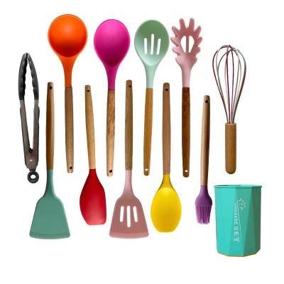 China Sustainable Feature 11Pieces Eco Silicone Kitchen Equipments Tool Kit Wooden Handle Heat Resistant Cooking Silicone for sale