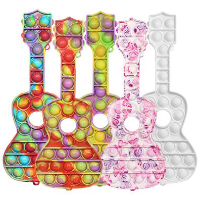 China Relieve the latest stress guitar solid color rainbow print and water transfer kids high quality plush sensory toys pack fidgety person kids toys 2021 for sale