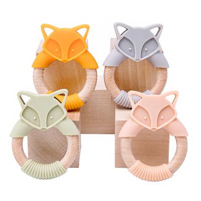 China Soft Wood and Silicone Toy Wholesale Cute Animal Shape Chewing Wooden Baby Toy Gift Set Teething Ring Teether for sale