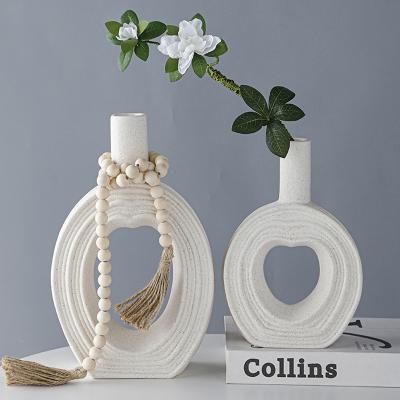 China New Creative Modern Home Decoration Heart Donut Vase Gift Ceramic Flower Vase For Office Living Room Decoration for sale