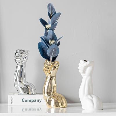 China Nordic popular modern male hand table living room ceramic flower vase for home decoration for sale